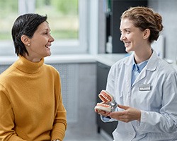 a dentist and her patient chatting