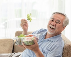 Dentures patient in Houston eating